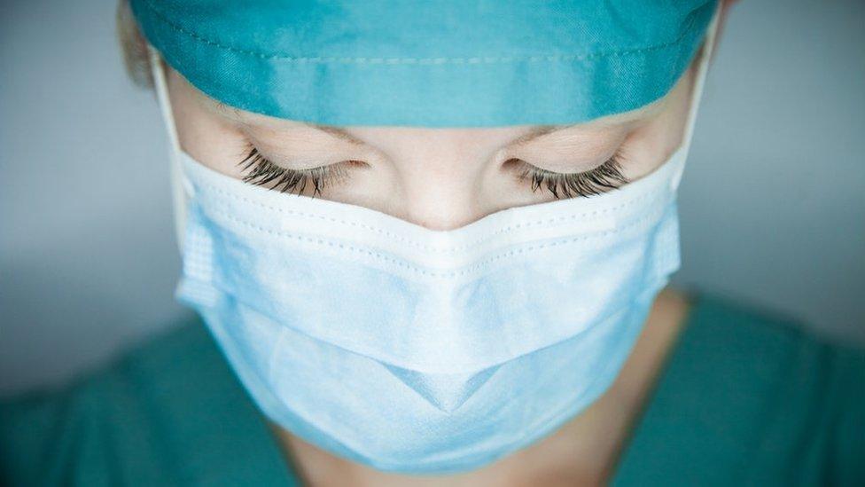 Nurse looking down - stock photo