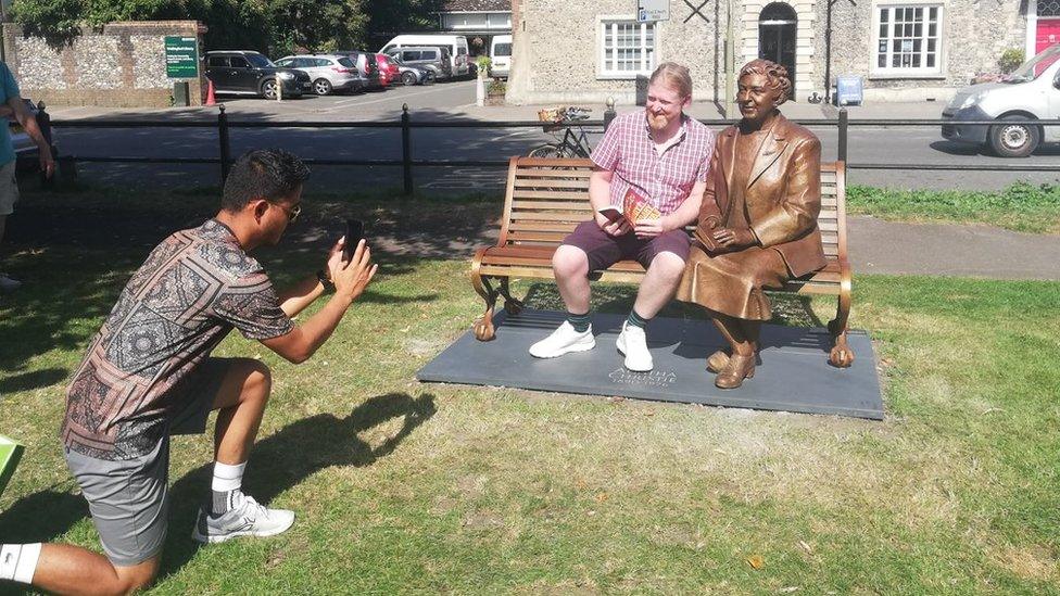 Visitors at Agatha Christie statue