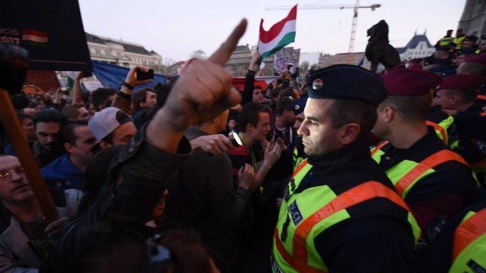 Demonstrators protest in front of policemen against what they say are plans to close the Central European University (09 April 2017)