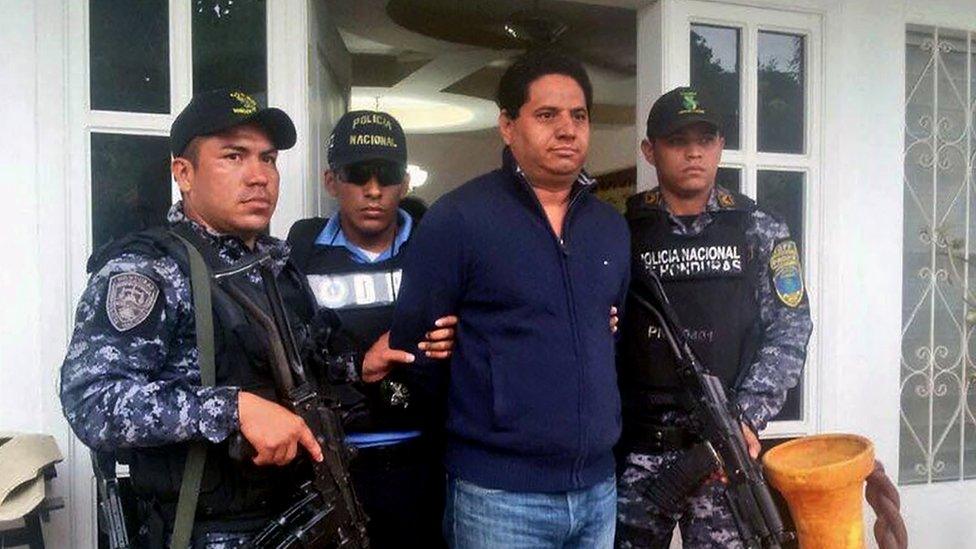 Mayor Delvin Salgado, flanked by police, being arrested