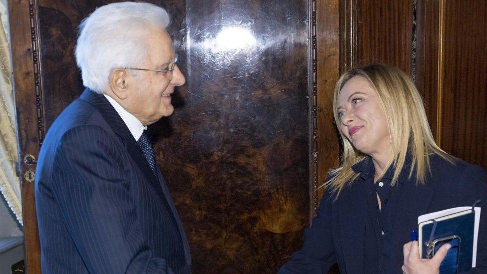 A handout photo shows Italian President Sergio Mattarella welcoming Italian designated Prime Minister Giorgia Meloni (R) at Quirinale in Rome, Italy, 21 October 2022