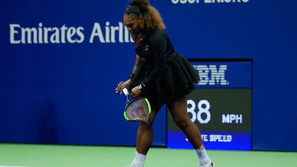 Serena Williams of the US smashes her racket while playing Naomi Osaka of Japan during their 2018 US Open women's singles final match