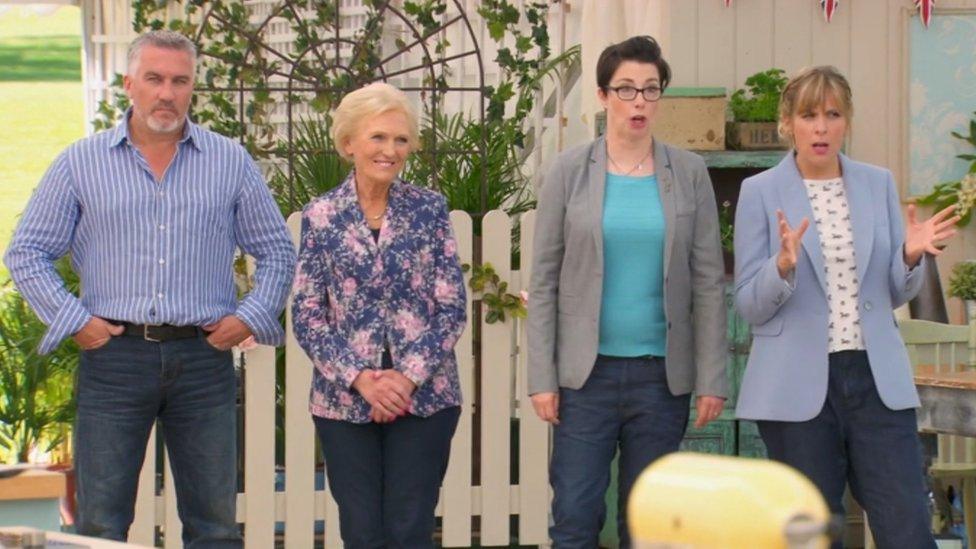 The judges and presenters of a previous series of Bake Off