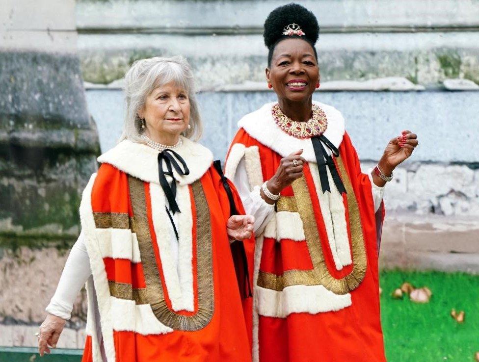 Dame Floella Benjamin in red, gold and white robes at Westminster Abbey