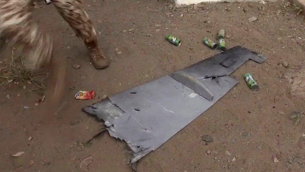 Screengrab taken from video showing Yemeni soldier walking past the wing of a drone that exploded above al-Anad military base in Lahj, Yemen (10 January 2019)