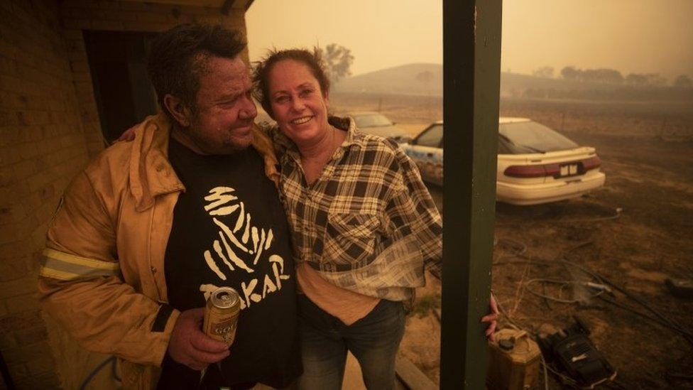 Lawrence and Claire Cowie are pictured after defending their home from a fast moving fire on Bumbalong Road, Bredbo North