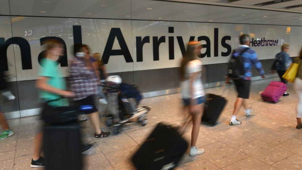 Passengers at Heathrow arrivals