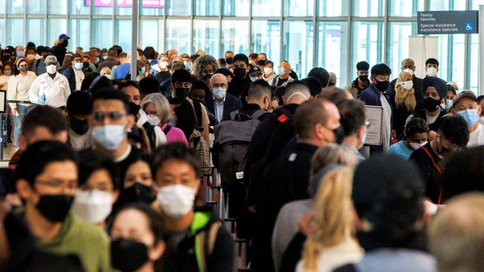 Travellers crowd the departures lounge at Toronto Pearson International Airport in Mississauga