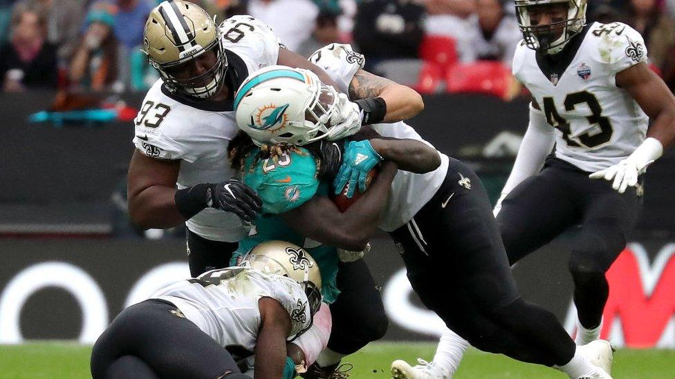 Jay Ajayi takes a tackle