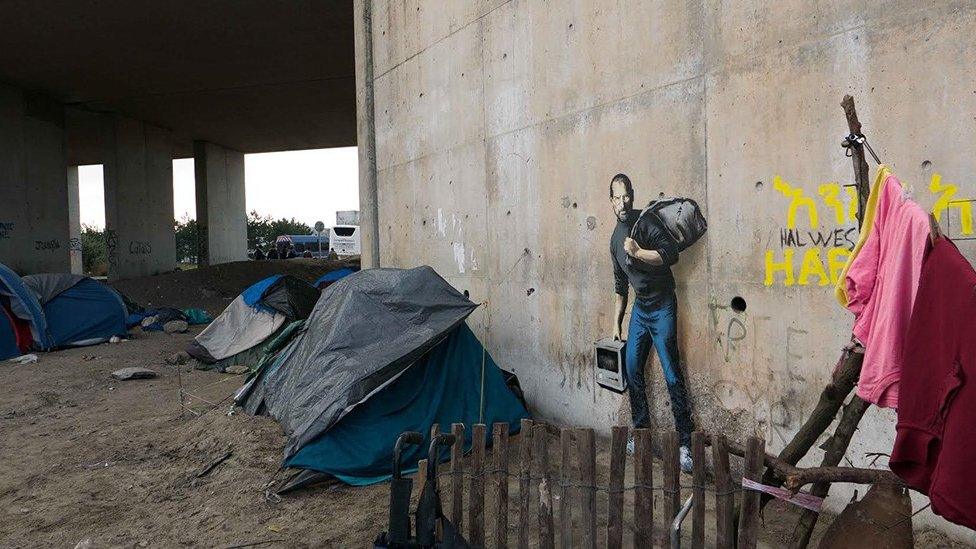 Banksy artwork at the Jungle refugee camp showing Steve Jobs