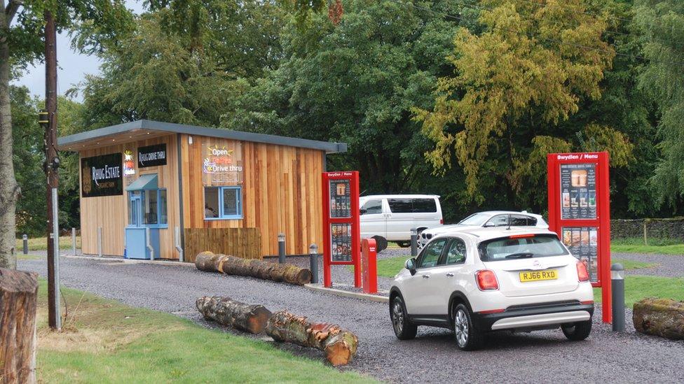 The Rhug Estate takeaway station with a car outside