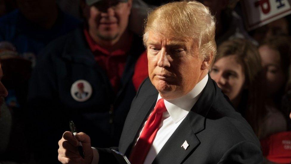 Donald Trump signs autographs at a rally in Tennessee