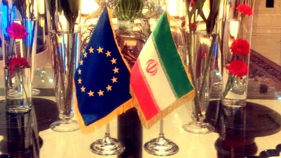 The EU and Iranian flags displayed in Tehran