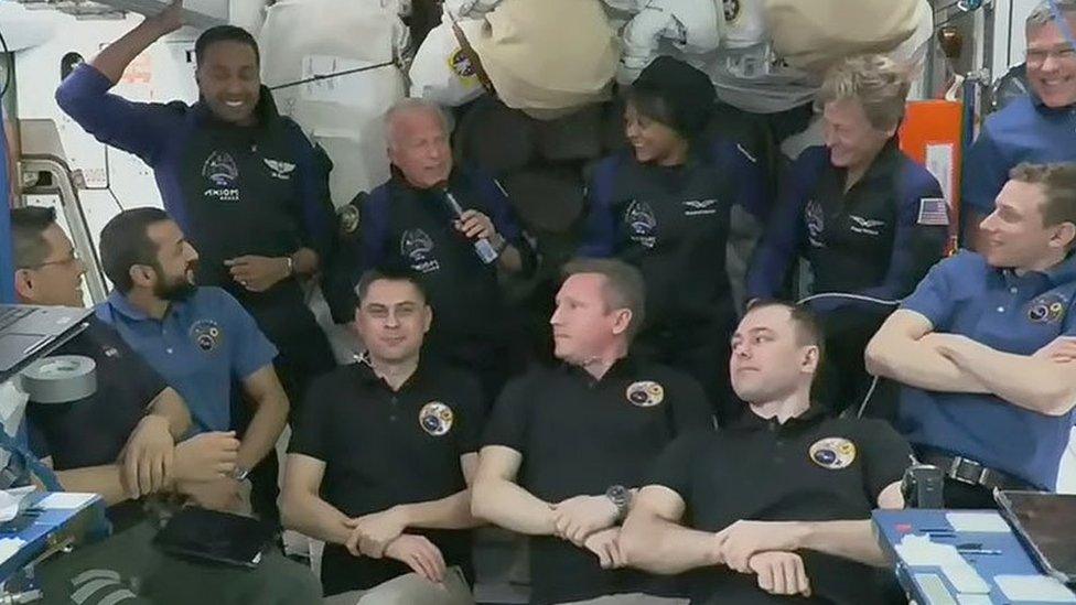 The four Axiom Mission 2 crew members, including Rayyanah Barnawi (top row, 3rd left), join seven other astronauts on board the International Space Station (22 May 2023)