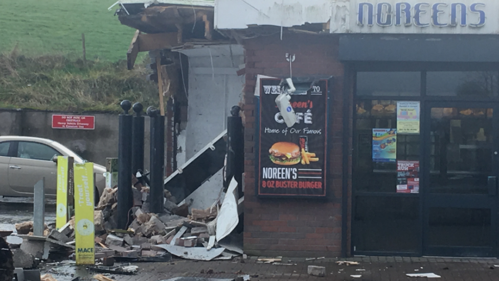 The damaged wall of the filling station