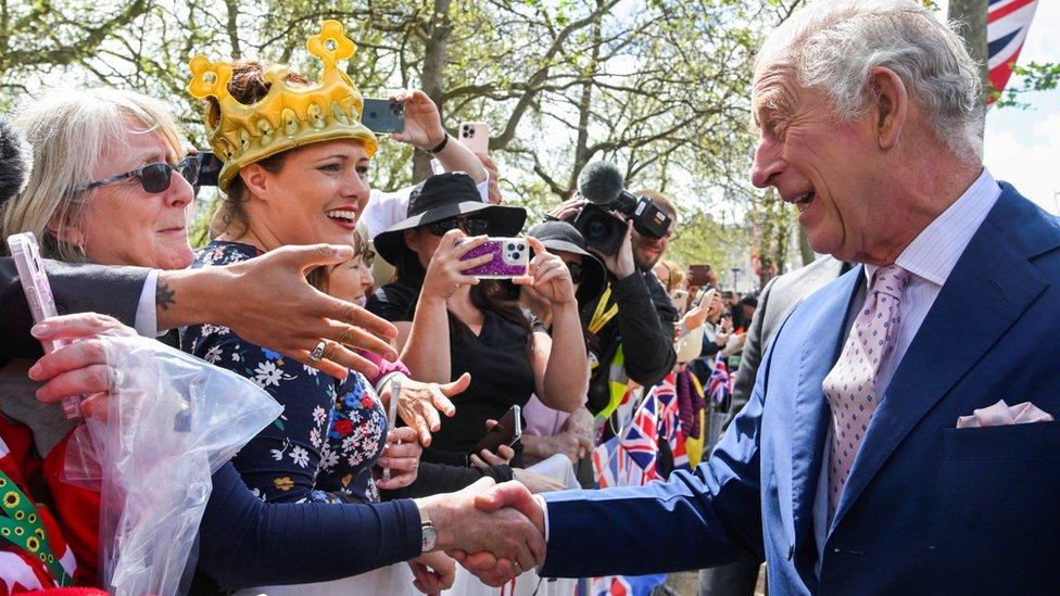 King Charles III meets well-wishers during a walkabout on the Mall outside Buckingham Palace ahead of his and Camilla, Queen Consort's coronation on May 5, 2023 in London, England.