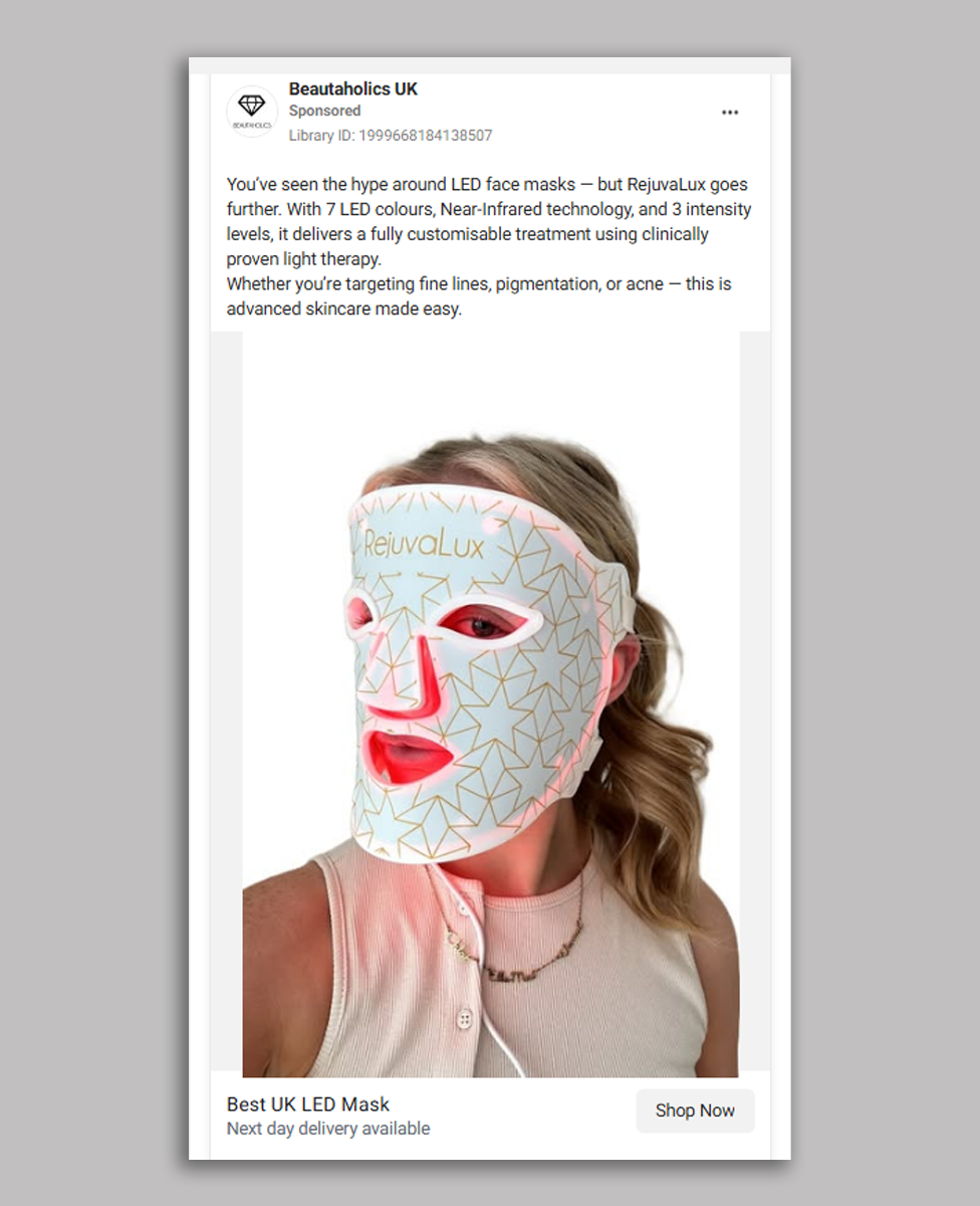 A social media advert showing a woman with blonde hair wearing a white LED mask with gold lines all over it and the brand Rejuvalux written across the forehead