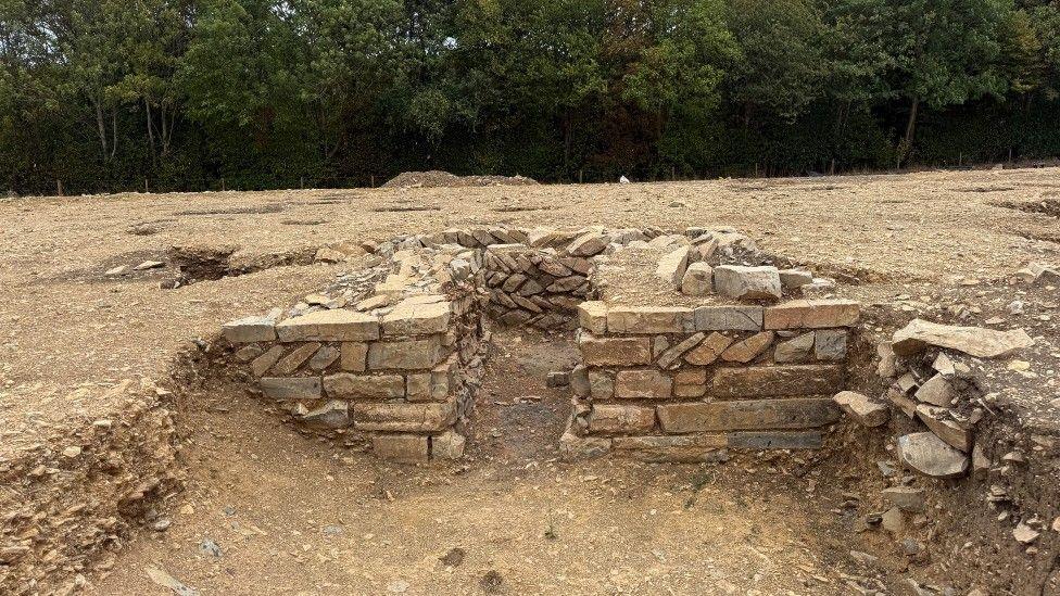 The remnants of a stone wall which was likely a Roman villa.
