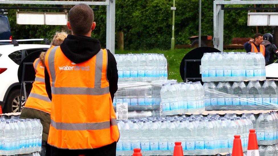 Broadsands Car Park, Brixham, Devon, UK, on 15 May 2024, where South West Water are handing out emergency rations of bottled water to anyone affected by the Cryptosporidium outbreak in Torbay