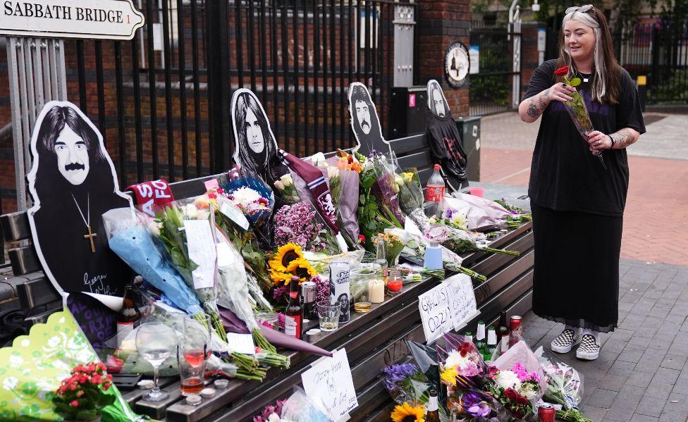Floral tributes are left on the Black Sabbath Bridge bench on Broad Street in Birmingham, following the death of Black Sabbath frontman Ozzy Osbourne aged 76. Picture date: Wednesday July 23, 2025.