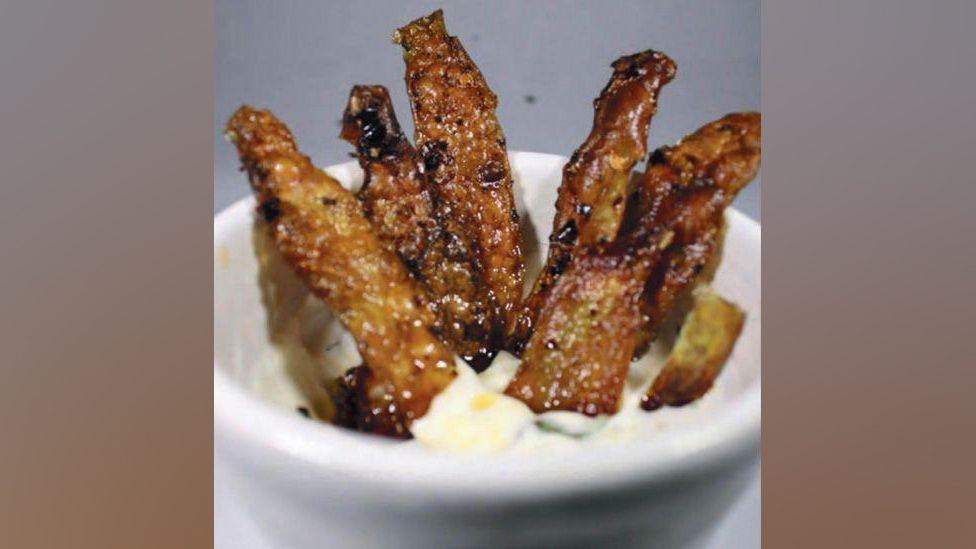 Crisps made from potato skin dipped in a mayonnaise pot