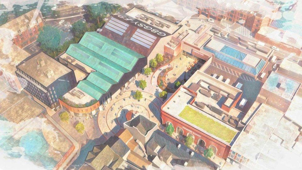 Aerial artist impression of the Freshney Place redevelopment showing a red brick market hall to the bottom right and a new tree-lined public square