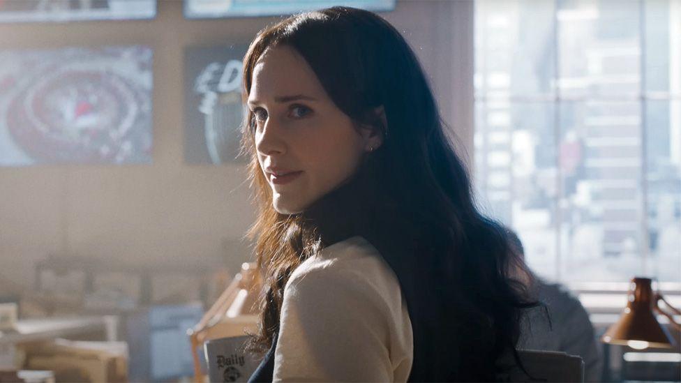 Rachel Brosnahan as Lois Lane in the Daily Planet office in a still from the trailer