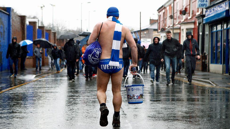Speedo Mick is seen arriving to the stadium prior to the Premier League match between Everton and Liverpool at Goodison Park on April 7, 2018 in Liverpool, England.
