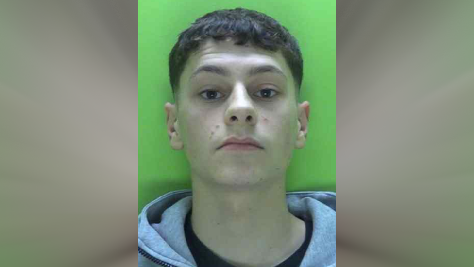 A police custody image of Harrison Cudworth against a green background