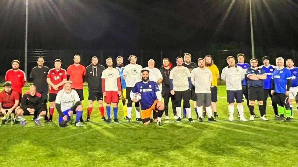 Man V Fat Brighton football squad on the pitch 