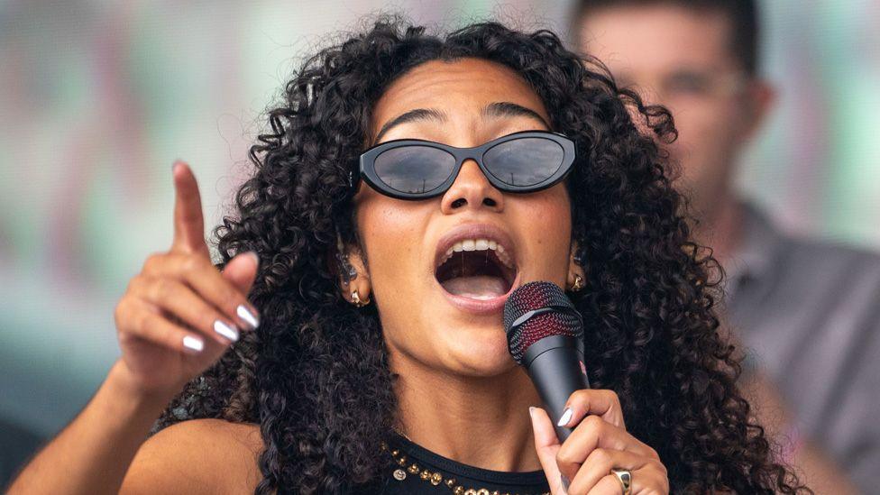 Olivia Dean on stage at Glastonbury