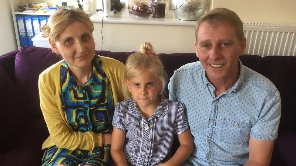 A family photo of Anca, Mary and Richard Falconer