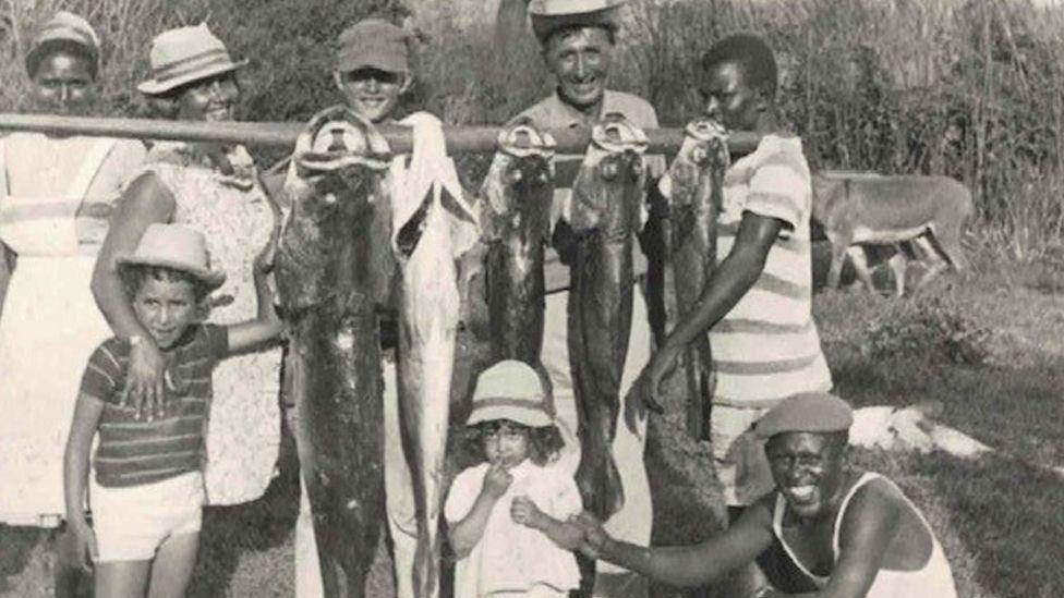 A black and white picture of a family group