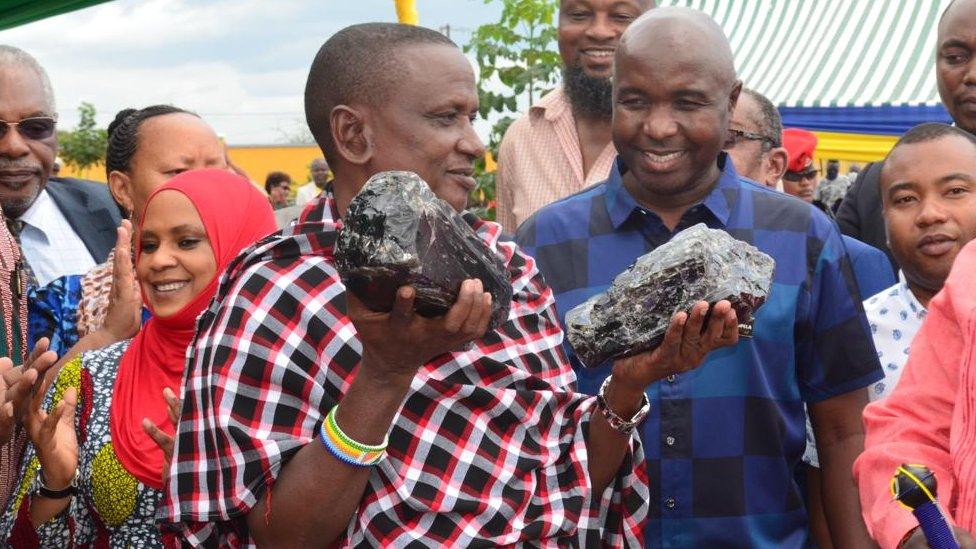 Saniniu Laizer carring the gemstones at the trading centre