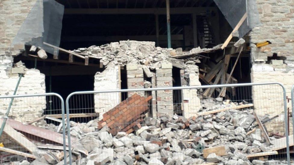 A collapsed wall at the building site in Bristol