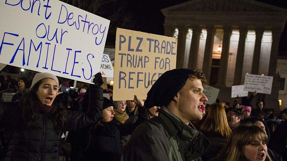 Immigration protestors rally outside the US Supreme Court.