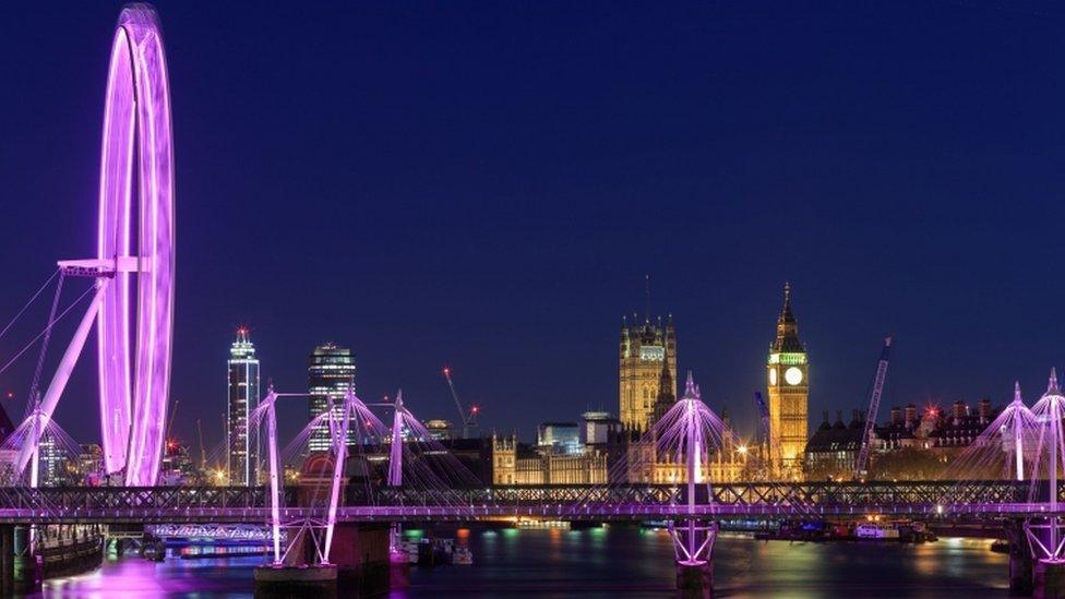 The London Eye is lit up in pink