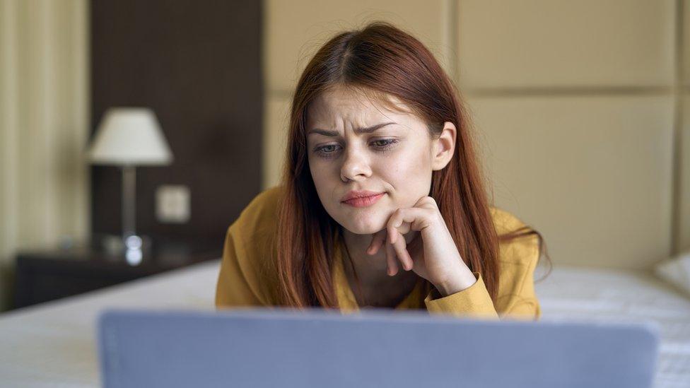 Person looking confused at computer