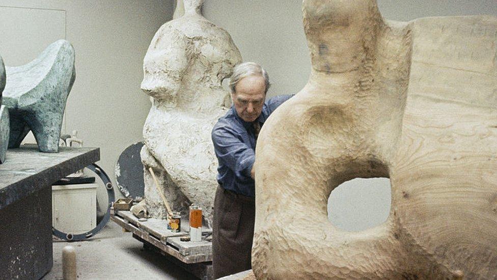 English artist and sculptor Henry Moore (1898 - 1986) surrounded by his works, circa 1965.