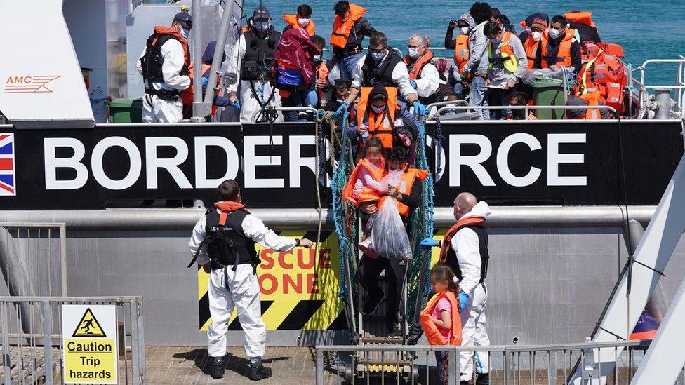 Migrants leave Border Force vessel in Dover on 5 August 2021 (file image)