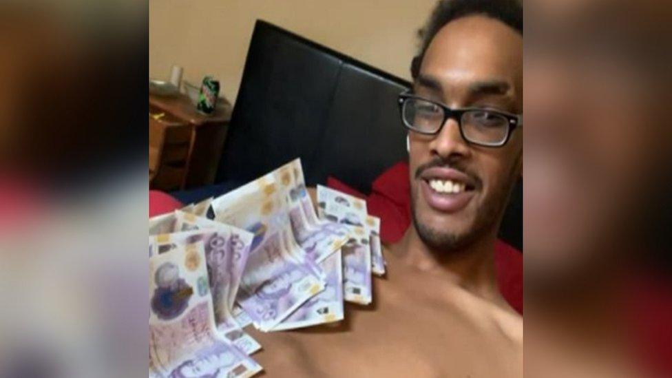 Mustafa Mahmood with cash on chest