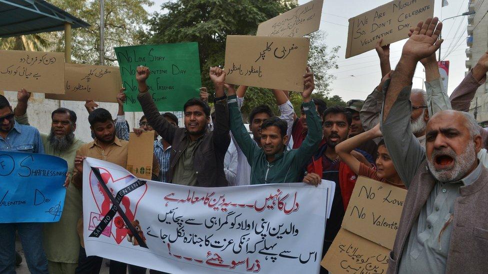 Pakistani demonstrators hold posters as they take part in a protest against Valentine"s Day in Karachi on February 13, 2016.