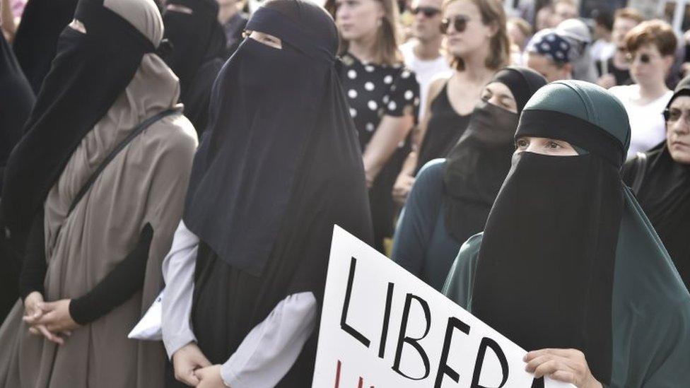 Women, dressed in burkas, in Denmark protesting against the country's new law