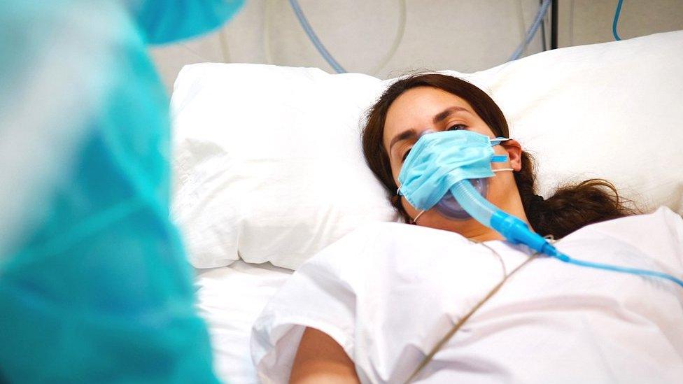 Woman in hospital bed