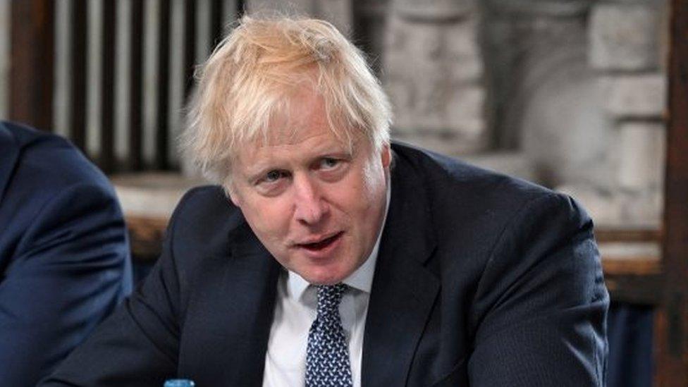 Boris Johnson flanked by Cabinet Secretary Simon Case, as he chairs a Cabinet meeting in Stoke-on-Trent