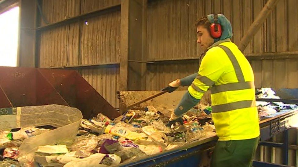 Recycling waste being sorted at facility in Buckley, Flintshire