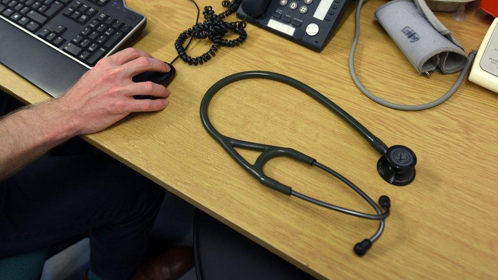 Stethoscope sat on stack of files