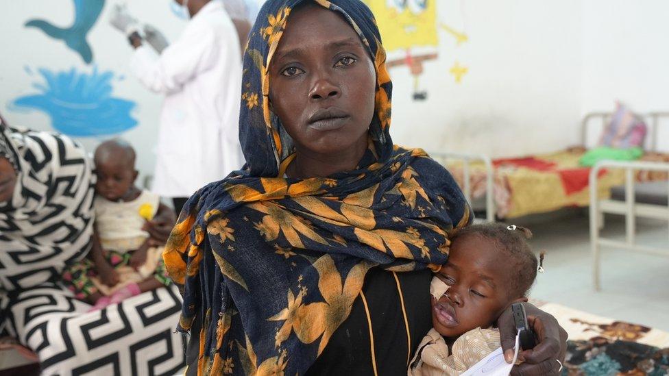 Mother Ikram with three-year-old Manasek who is suffering from severe malnutrition