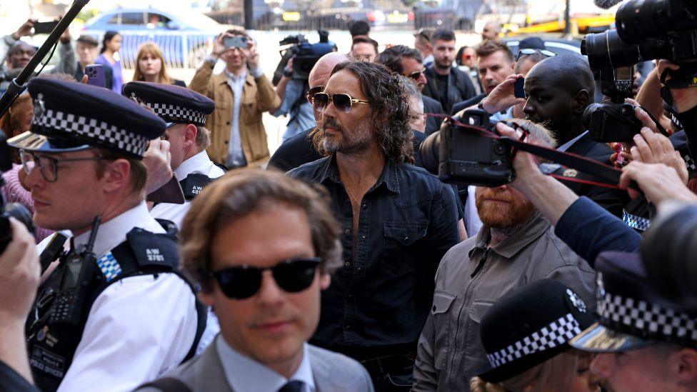 Russell Brand arrives at Westminster Magistrates' Court on May 02, 2025 in London, England
