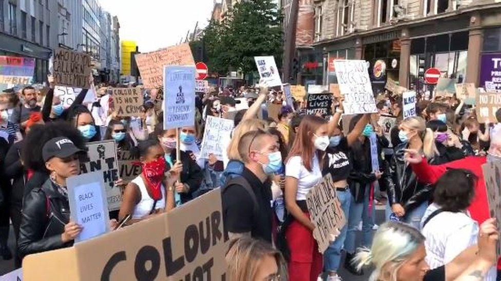 A large crowd has gathered at Belfast City Hall to protest over the death of George Floyd